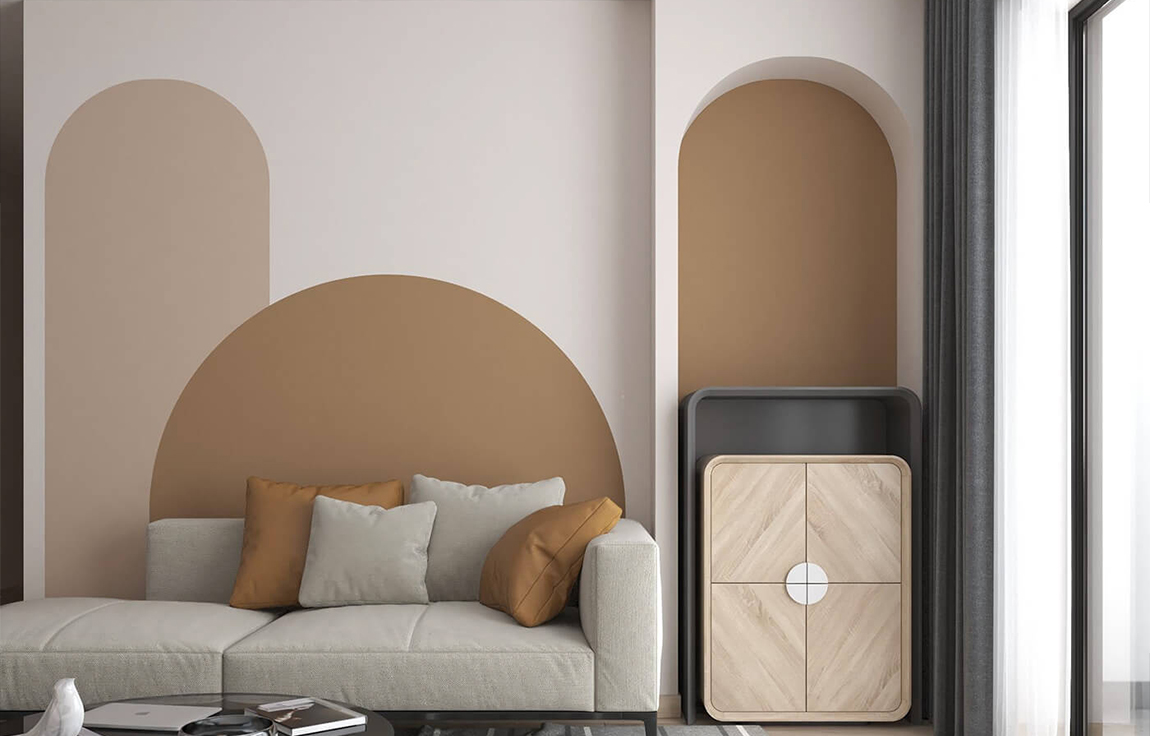 Salon tendance et lumineux avec des formes sur le mur et un canapé gris
